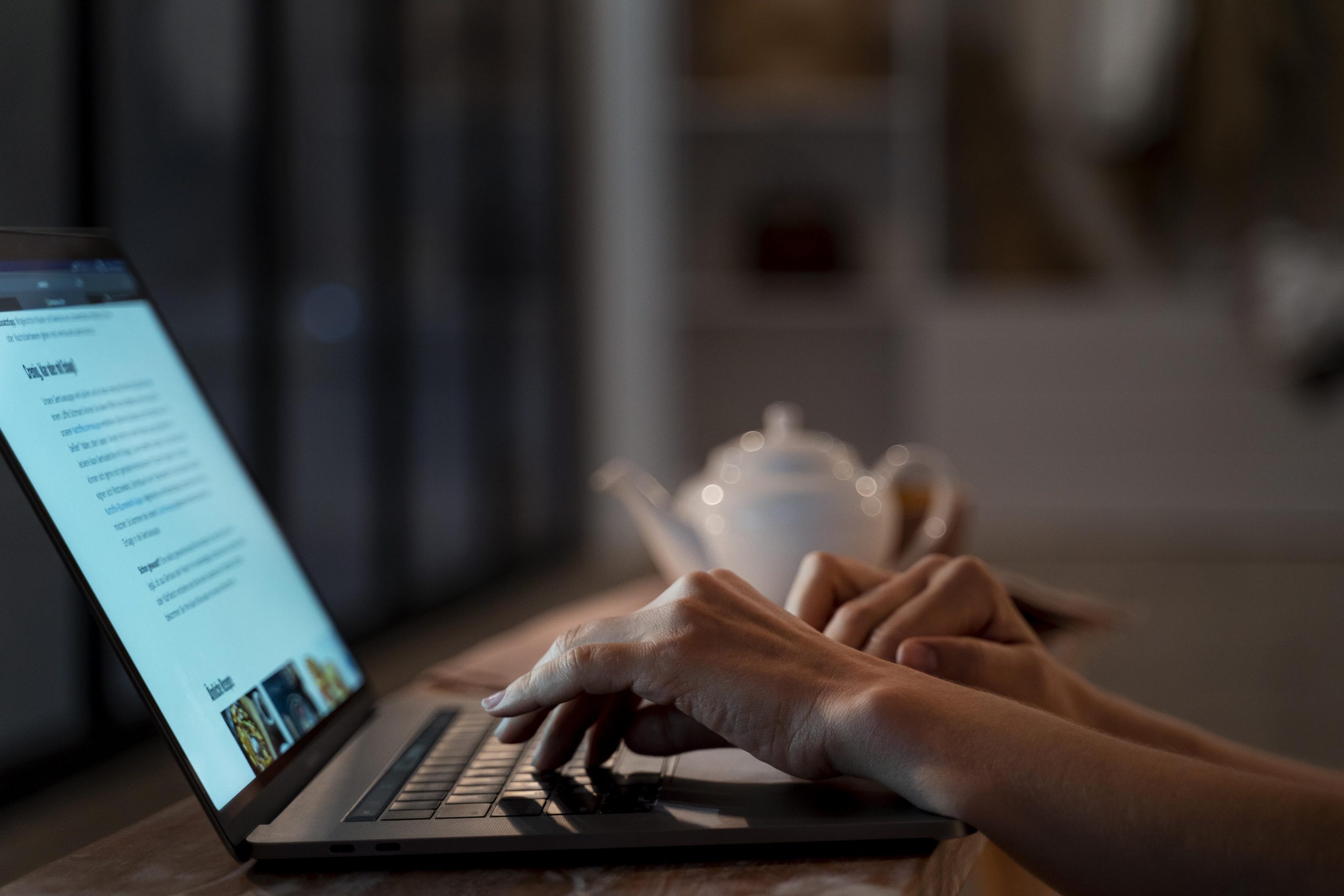 close-up-on-person-working-at-home-at-night